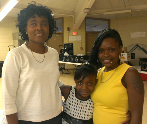 Delores Taylor, Keyashia, and Whitney Taylor celebrate after the SFP graduation ceremony.