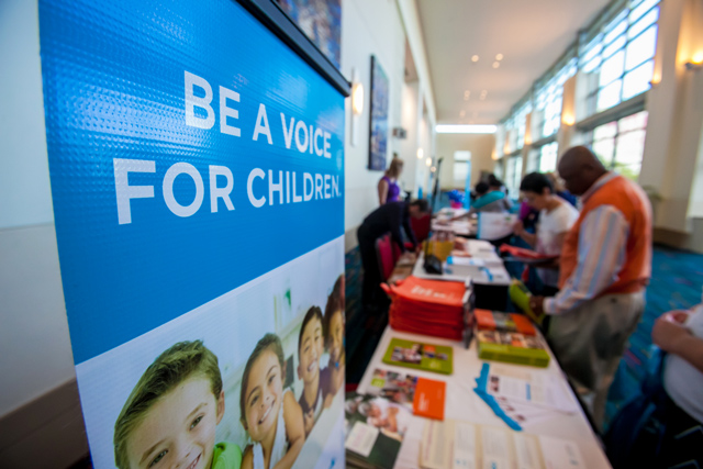 Attendees gathered at the Children's Trust information tables to ask questions and pick up literature.
