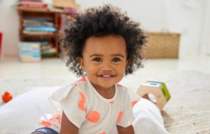 Baby-Girl-Playing-in-Playroom