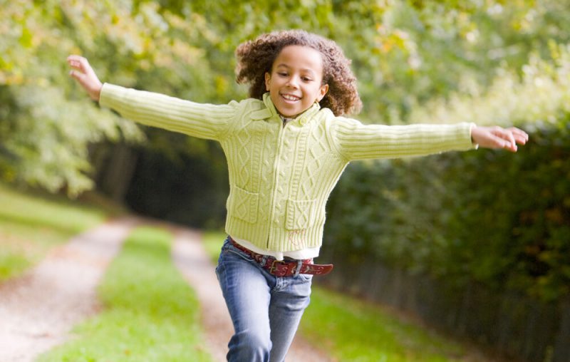 Young-teenage-girl-running-outside