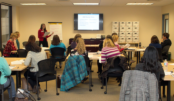 ACE Master Trainers engage in a session on adverse childhood experiences at the Children's Trust office.