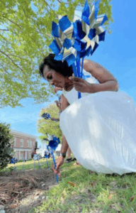 - Children's Trust of South Carolina Woman planting pinwheels