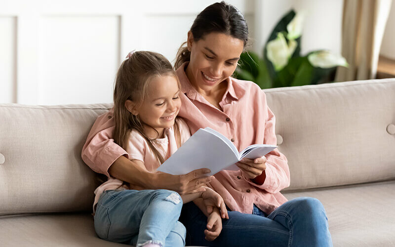 Mixed_race_mother_reading_to_her_daughter_on_the_sofa-800x0-c-default Mixed_race_mother_reading_to_her_daughter_on_the_sofa.