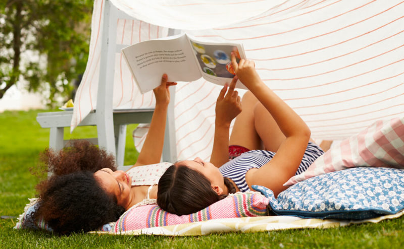 Mother-And-Daughter-Playing-In-Home-Made-Garden-Den