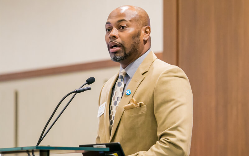 Eric Bellamy speaks at the podium.