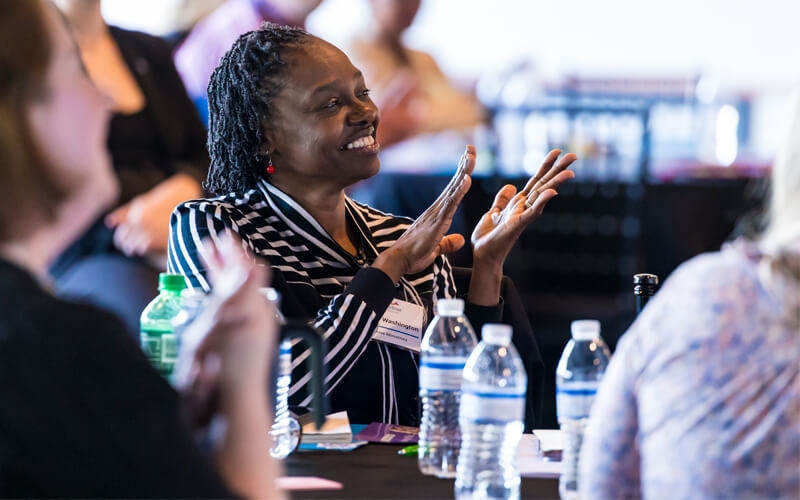 Partner_at_event_smiling_after_presentation