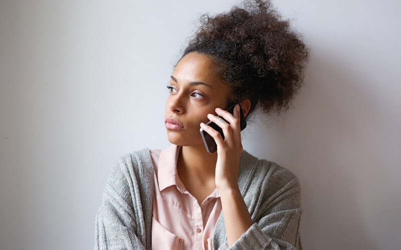 Concerned black woman on the phone