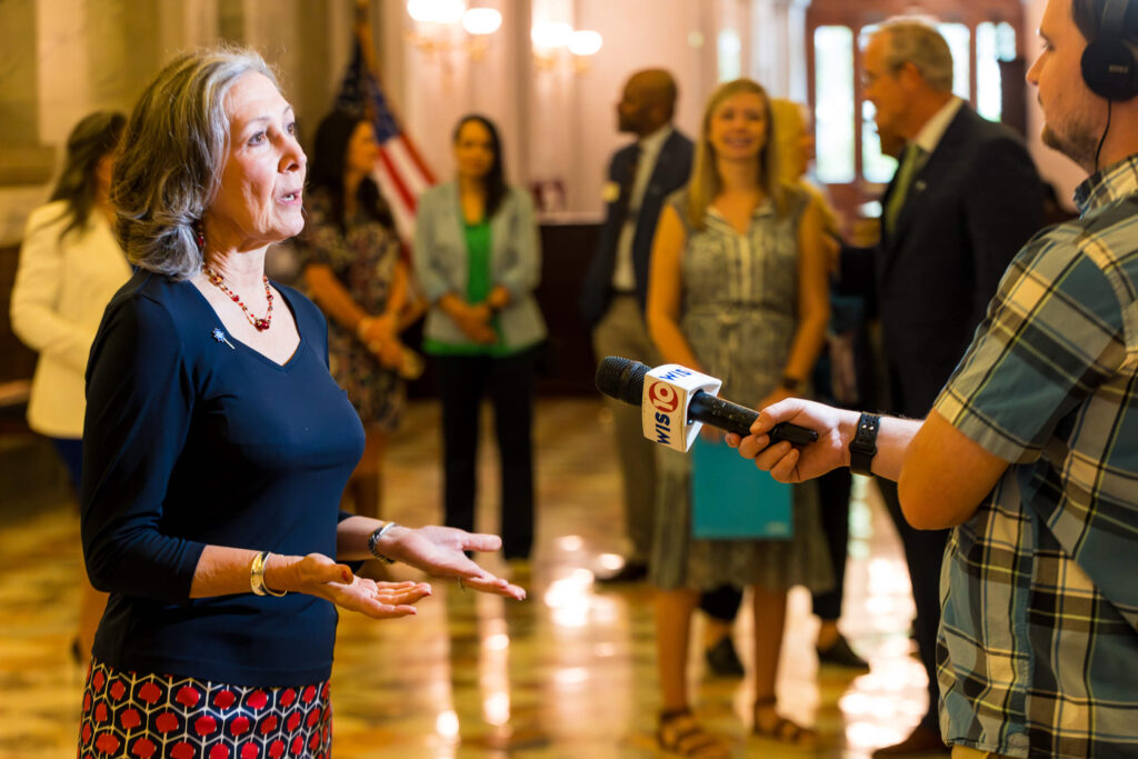 Sue Williams talks to a reporter.