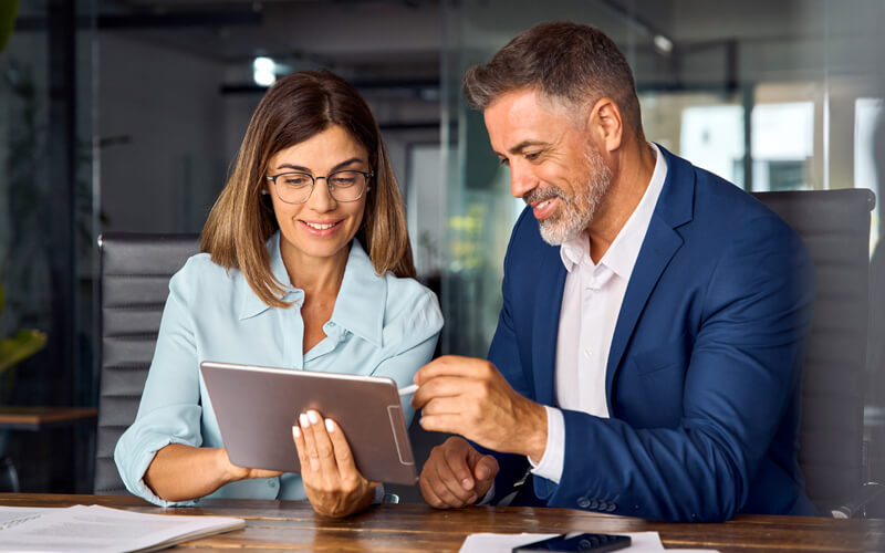 Team-of-diverse-partners-sitting-at-table