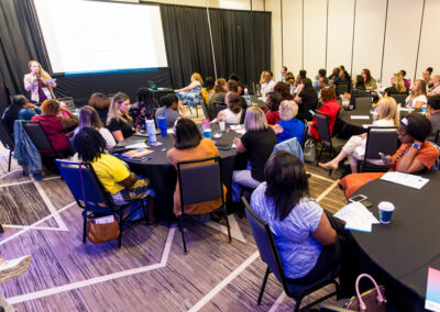 Attendees listen to a speaker during a session at the 2024 Building Hope for Children Conference.