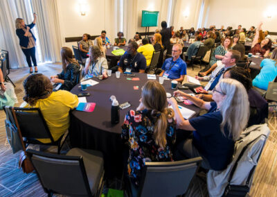Attendees listen to a speaker during a session at the 2024 Building Hope for Children Conference.