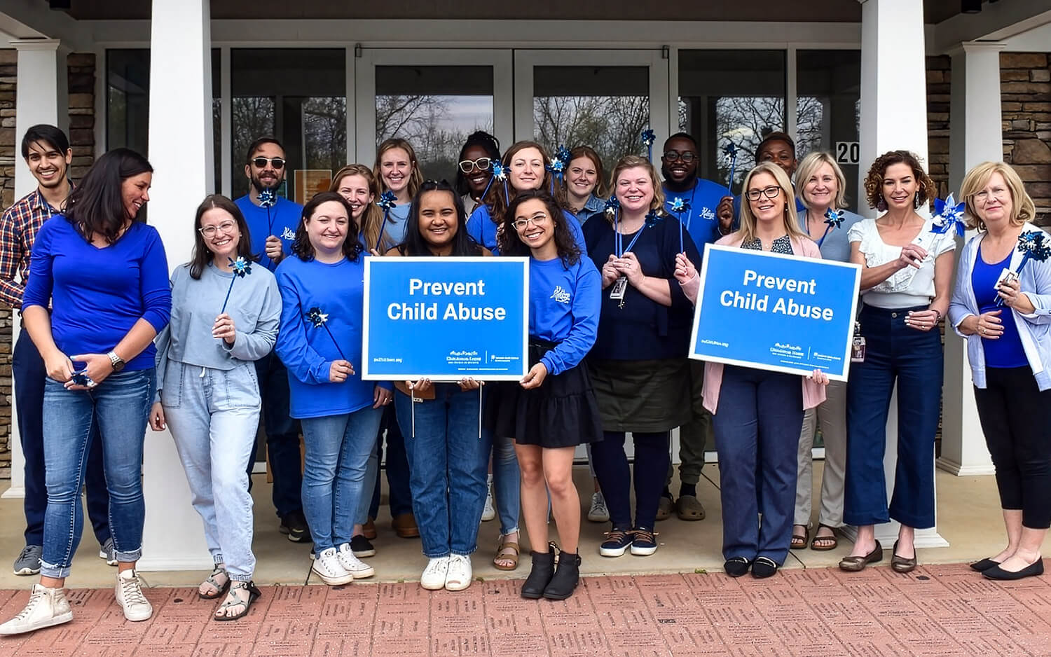 Members of, A Childs Haven holding pinwheels.