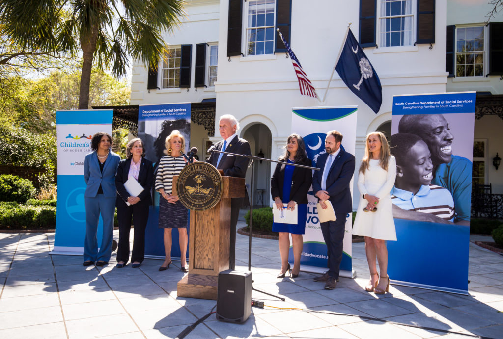 Gov. McMaster speaks with child-serving agencies behind him at a press conference hosted at the Governor's Mansion.