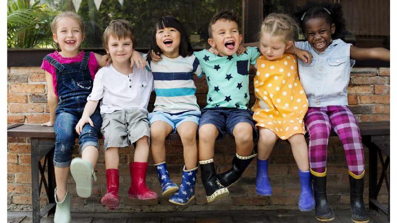 Happy children sitting together