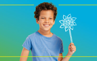 Boy holding pinwheel.