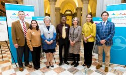 Children's Trust Board members stand at the South Carolina State House to announce the 2024 policy agenda