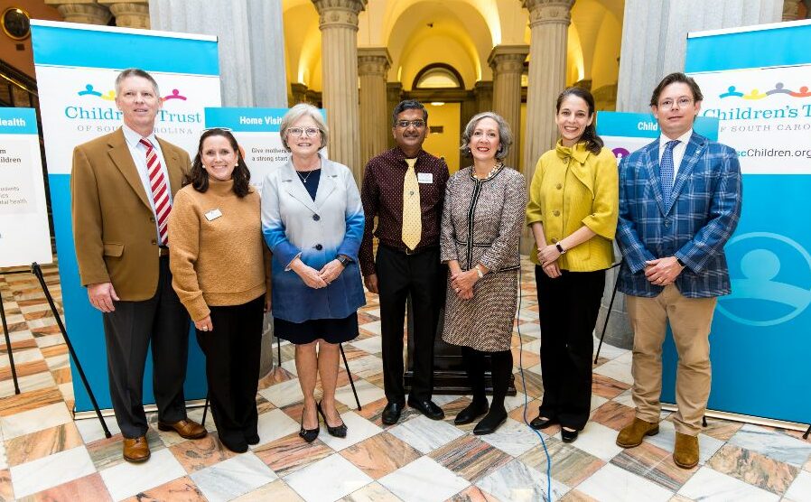 Children's Trust Board members stand at the South Carolina State House to announce the 2024 policy agenda