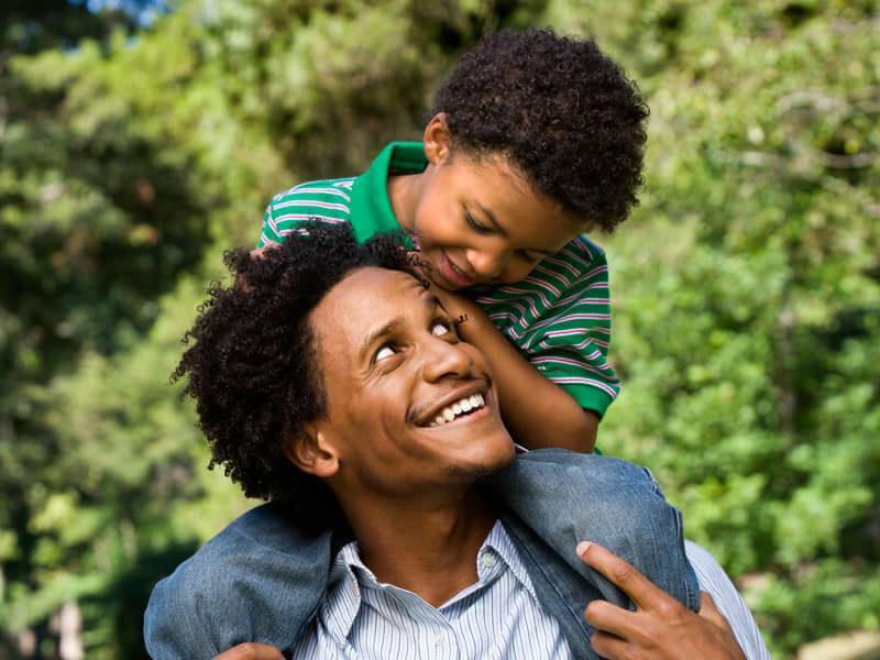 Father with son on his shoulders