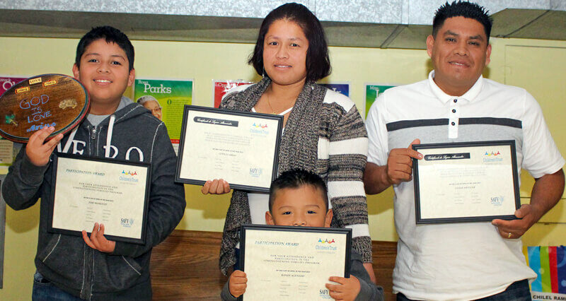 Hispanic family at a strengthening families program graduation in Greenville, South Carolina.