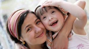 caregiver and child hugging