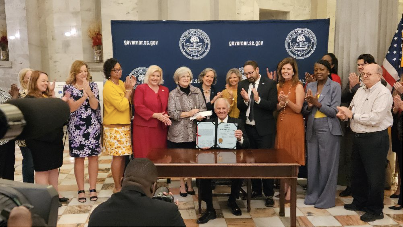 Gov. McMaster and other state leaders at a ceremonial signing for the KinGAP bill.