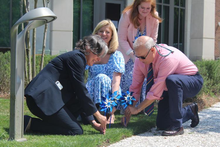 Sue williams and partners plant pinwheels
